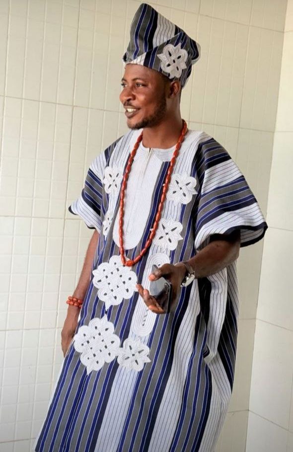 Babalawo smiling in traditional dress